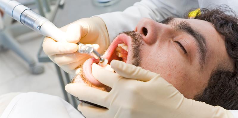 Patient getting a teeth cleaning.