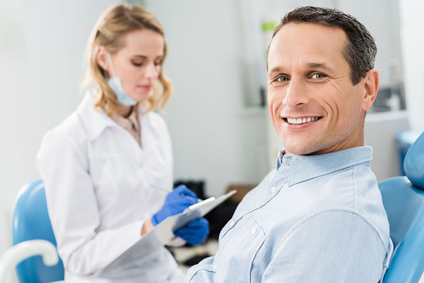patient checking for his dental implant candidacy