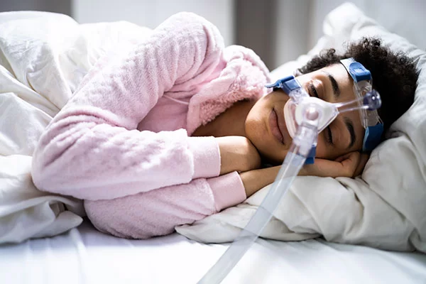 woman wearing a cpap mask