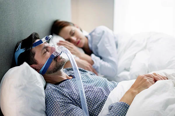 man wearing a bipap mask