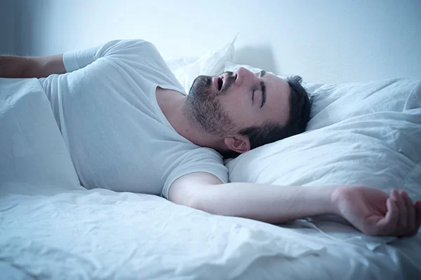 man suffering from loud, excessive snoring